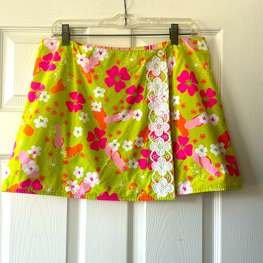 Lilly Pulitzer reversible wrap mini skirt, flip flops and mosaic sun prints